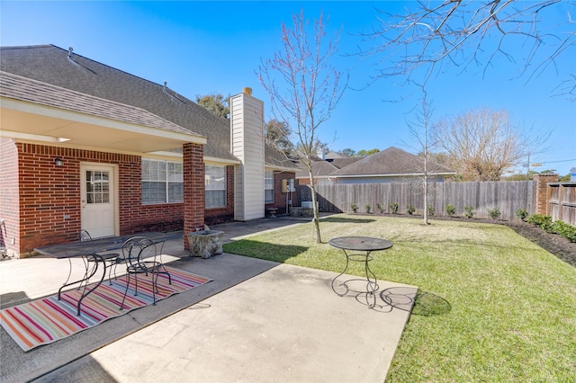 view of patio / terrace featuring fence