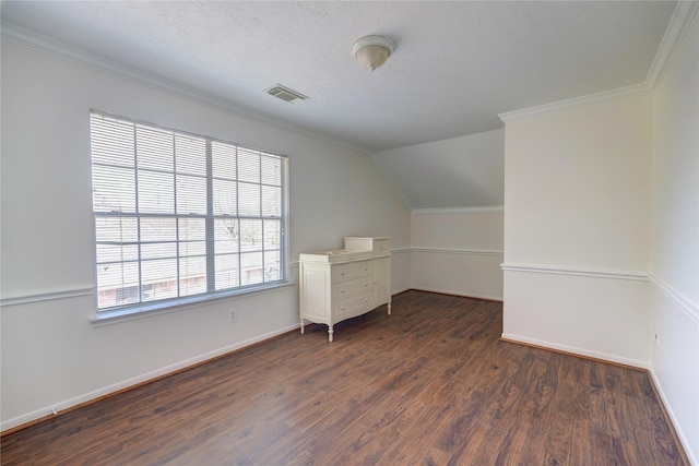 bonus room featuring visible vents, baseboards, vaulted ceiling, a textured ceiling, and dark wood-style flooring