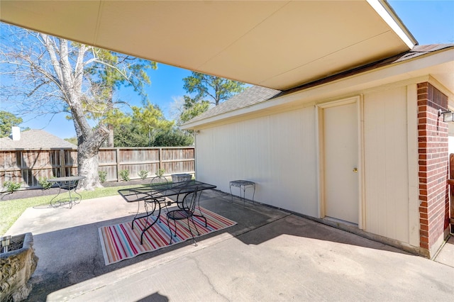 view of patio / terrace with outdoor dining space and fence