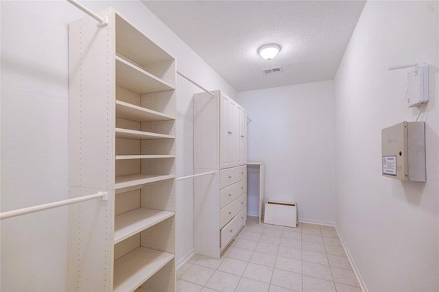 walk in closet with visible vents