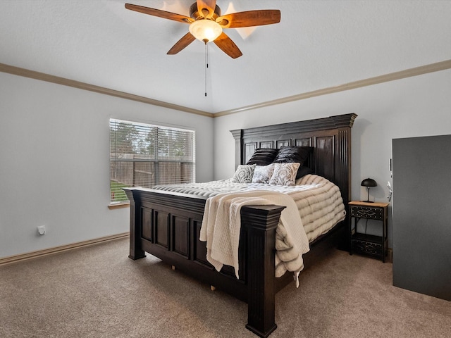 carpeted bedroom with lofted ceiling, baseboards, a ceiling fan, and crown molding