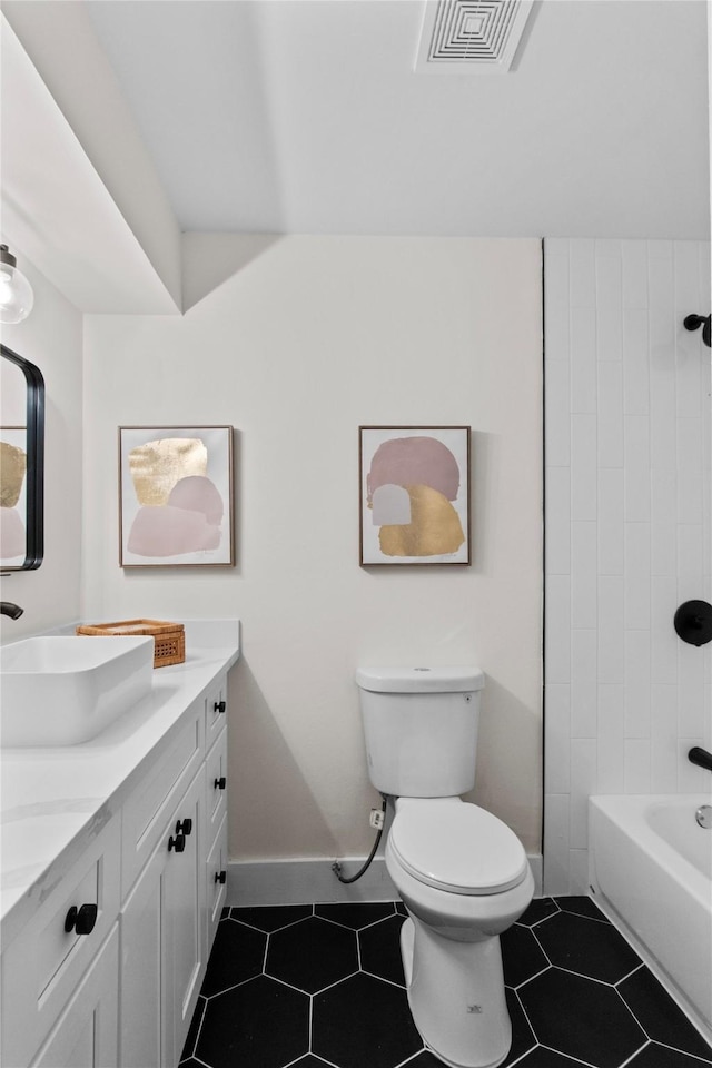 full bathroom featuring toilet, vanity, tile patterned flooring, and visible vents