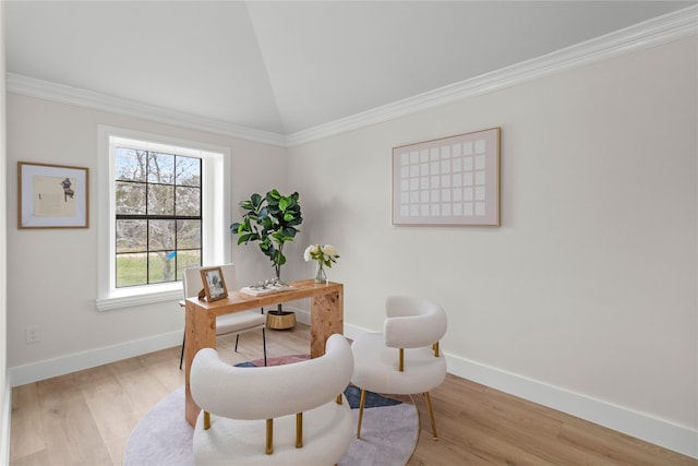 home office with lofted ceiling, baseboards, light wood-style flooring, and crown molding