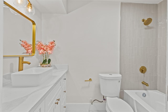 full bathroom with baseboards, bathing tub / shower combination, toilet, and vanity