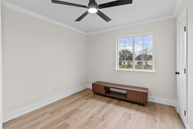 interior space with ornamental molding, light wood-style flooring, baseboards, and a ceiling fan