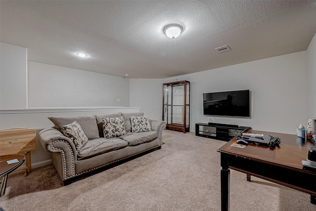 living area featuring a textured ceiling, carpet floors, visible vents, and baseboards