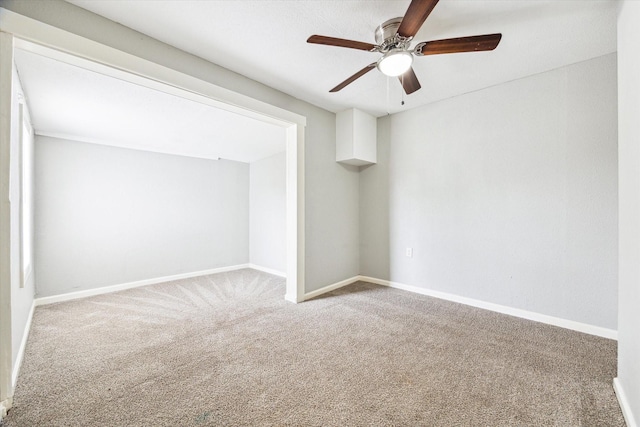 interior space with ceiling fan and baseboards