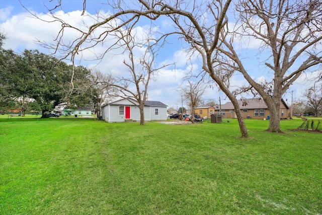 view of yard featuring entry steps and a residential view