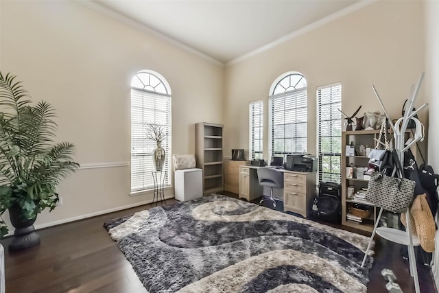 home office featuring a healthy amount of sunlight, baseboards, dark wood finished floors, and crown molding