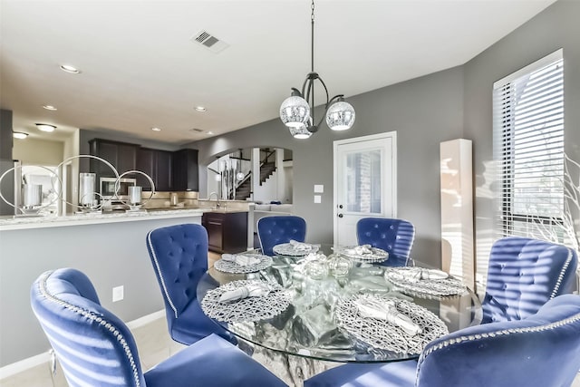 dining area with recessed lighting, visible vents, an inviting chandelier, baseboards, and stairs