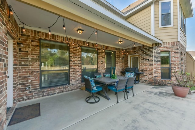 view of patio / terrace featuring area for grilling and outdoor dining space