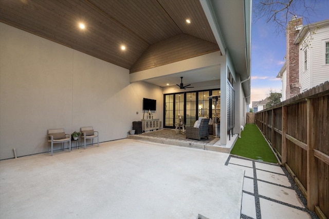 view of patio with fence and a ceiling fan