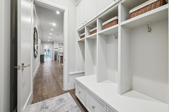 mudroom with dark wood-type flooring and recessed lighting