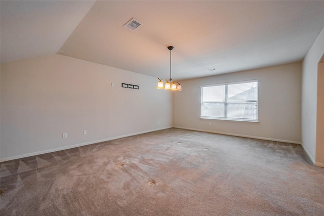 unfurnished room with visible vents, a notable chandelier, lofted ceiling, carpet, and baseboards