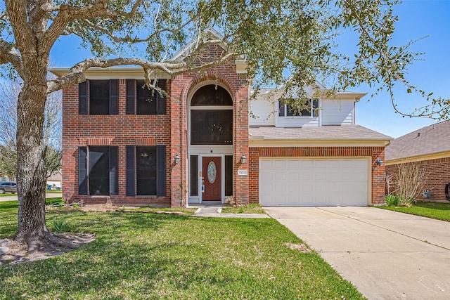 traditional-style house with a front lawn, brick siding, a garage, and driveway