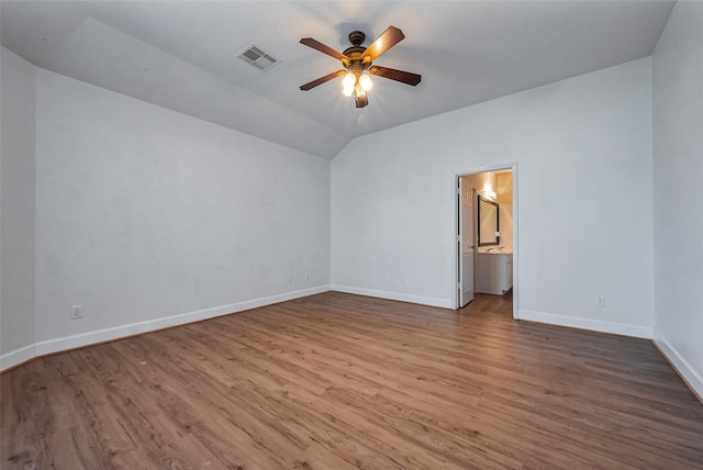 spare room with visible vents, baseboards, ceiling fan, and wood finished floors