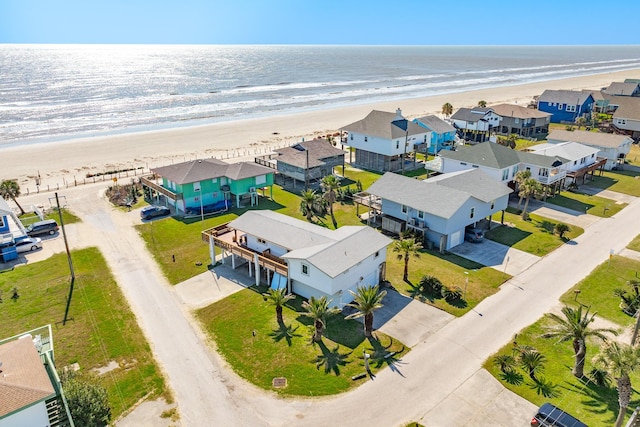 aerial view featuring a water view, a residential view, and a view of the beach