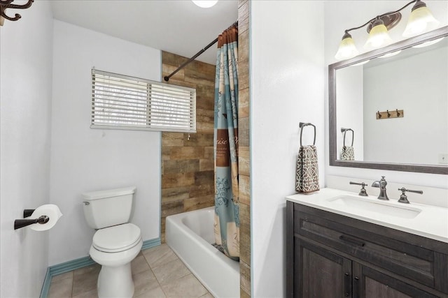 full bathroom featuring tile patterned flooring, toilet, vanity, baseboards, and shower / bath combo