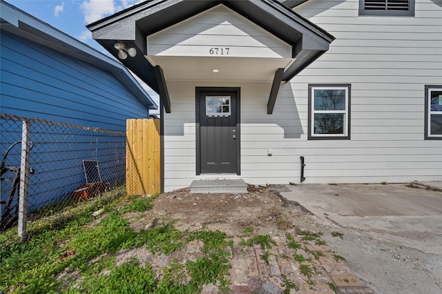 doorway to property with fence