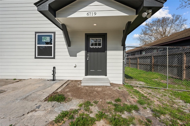 doorway to property with fence