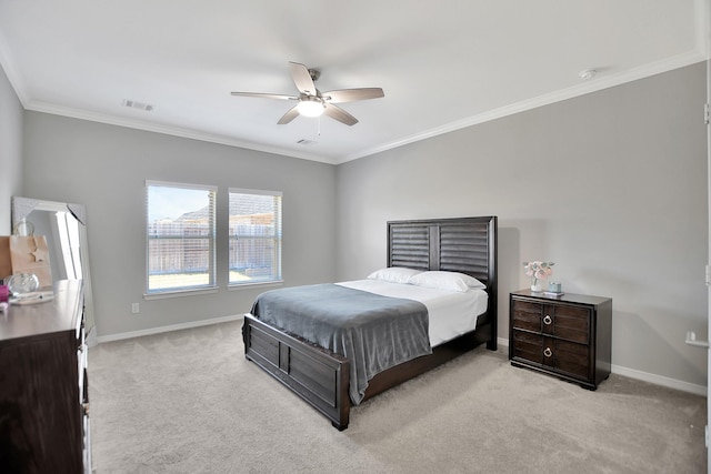 bedroom with light carpet, baseboards, visible vents, ceiling fan, and ornamental molding