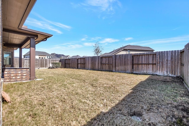 view of yard with a fenced backyard