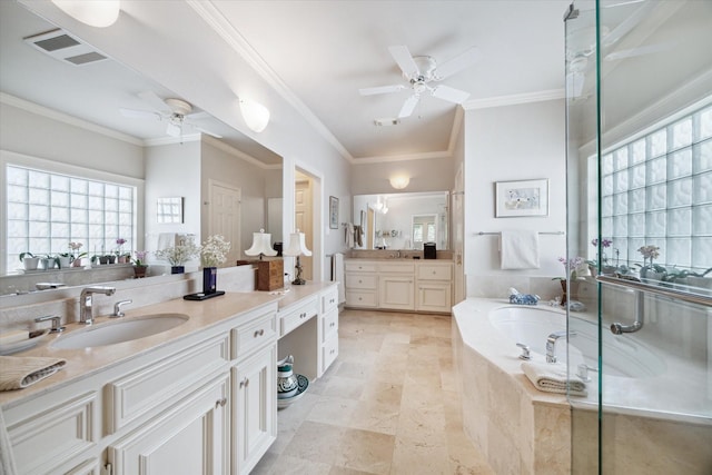 full bathroom with a garden tub, two vanities, visible vents, ornamental molding, and a sink