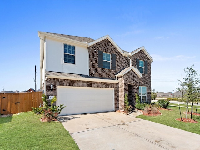 traditional-style home featuring driveway, fence, a front lawn, and brick siding