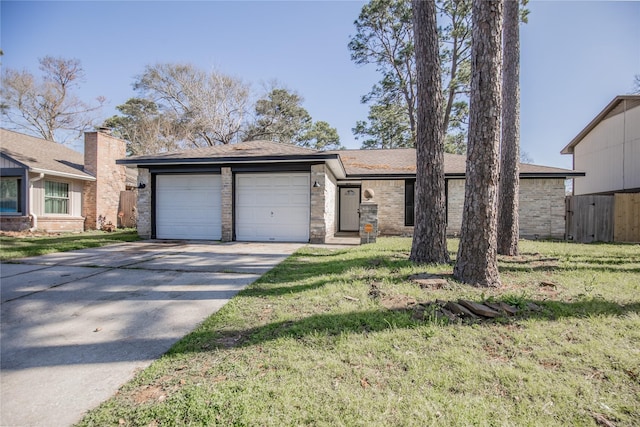 view of front of home featuring a garage, a front lawn, and concrete driveway