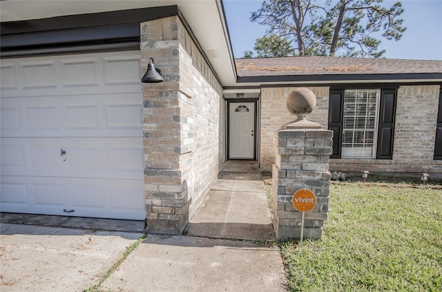 property entrance featuring a shingled roof and brick siding