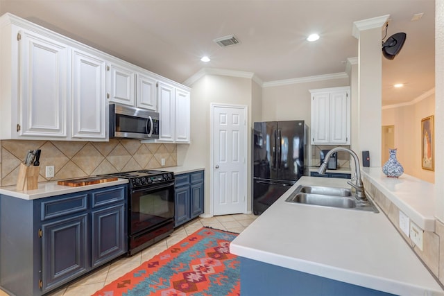 kitchen with blue cabinets, black appliances, white cabinets, and a sink