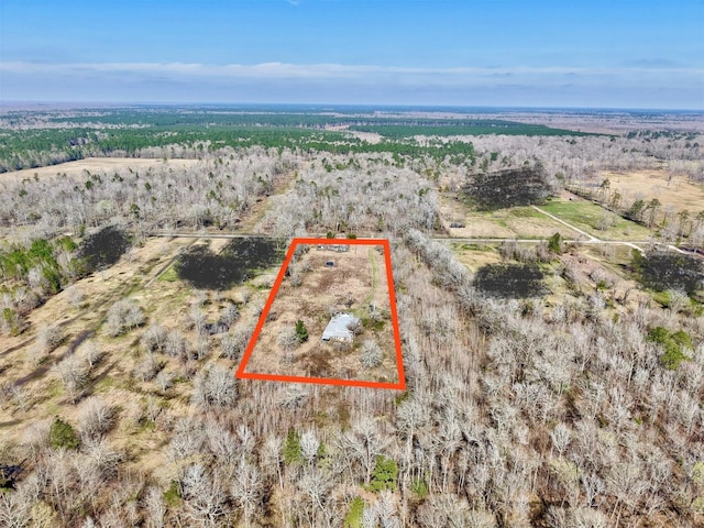 birds eye view of property with a rural view