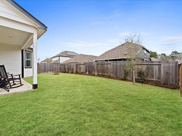 view of yard with a patio area and a fenced backyard