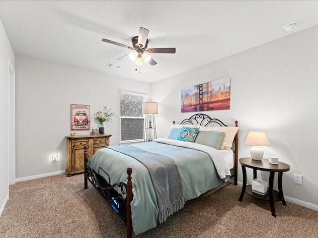 bedroom with a ceiling fan, baseboards, visible vents, and carpet flooring