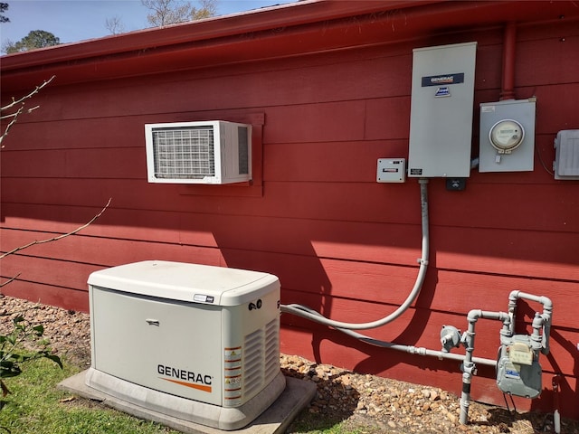 details featuring electric meter and a power unit