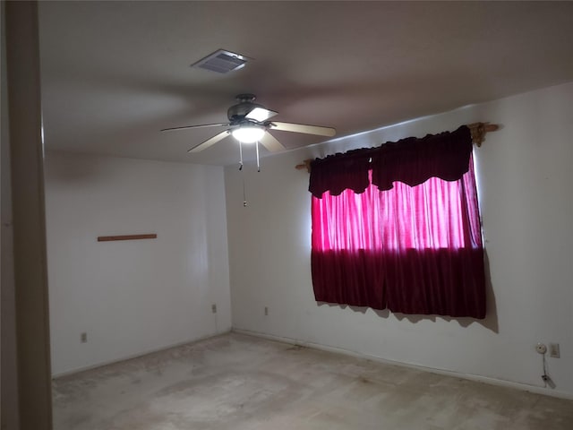 spare room with visible vents and ceiling fan