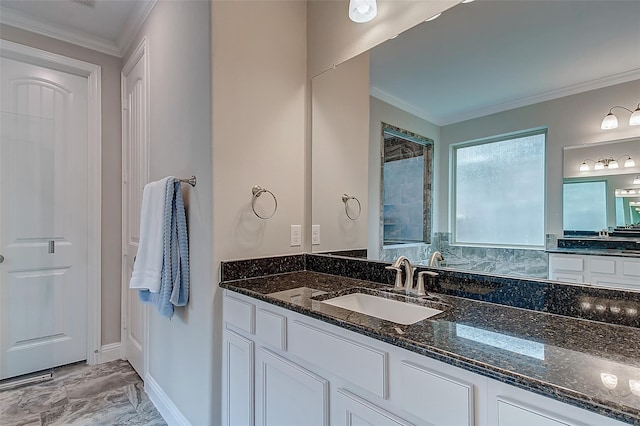 full bath featuring ornamental molding, vanity, and baseboards