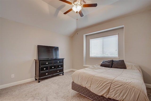 carpeted bedroom featuring a ceiling fan, lofted ceiling, and baseboards