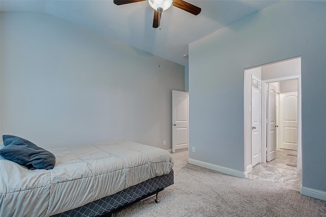 bedroom featuring lofted ceiling, light colored carpet, ceiling fan, and baseboards