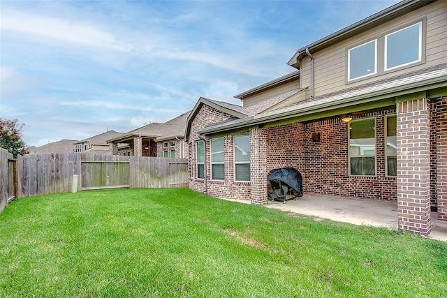 view of yard featuring a patio and a fenced backyard