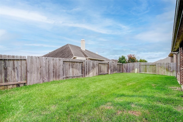 view of yard featuring a fenced backyard