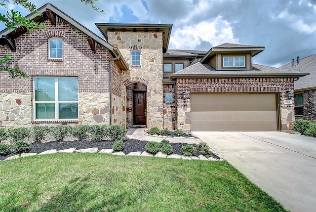 view of front of home with a garage, brick siding, stone siding, concrete driveway, and a front lawn