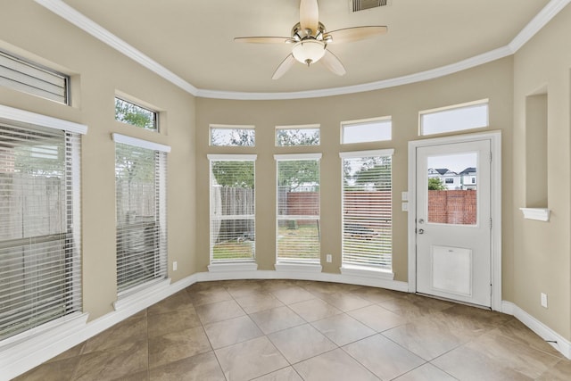 unfurnished sunroom featuring visible vents and a ceiling fan