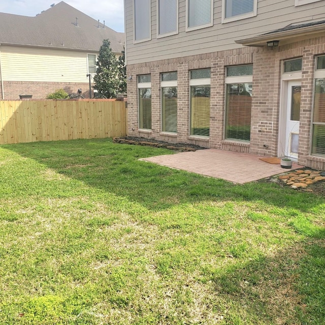 view of yard with a patio area and fence