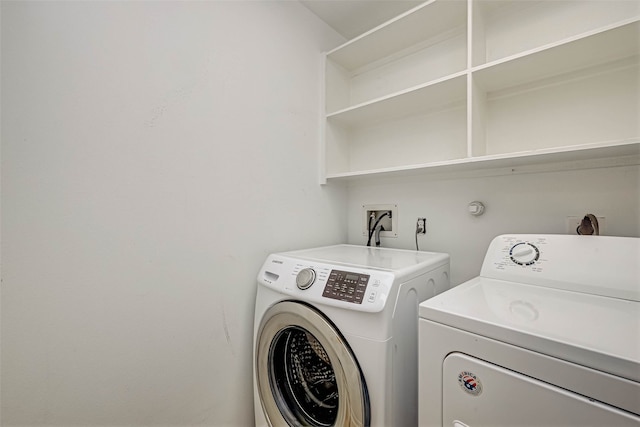 laundry area featuring laundry area and washing machine and dryer