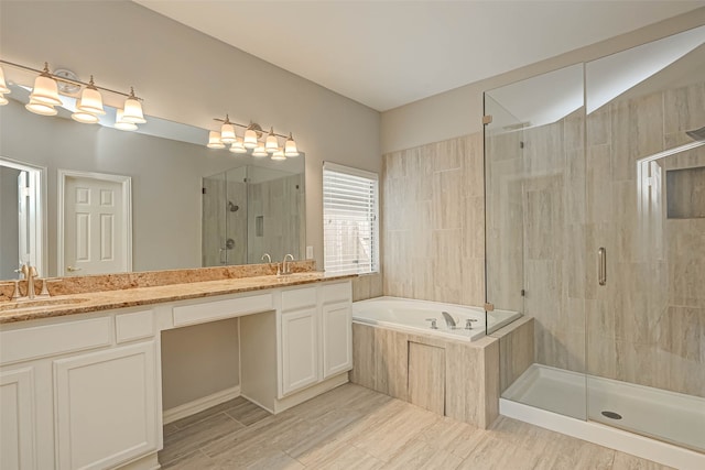 full bath with double vanity, a stall shower, a sink, and a bath