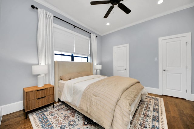 bedroom with baseboards, dark wood finished floors, crown molding, and recessed lighting