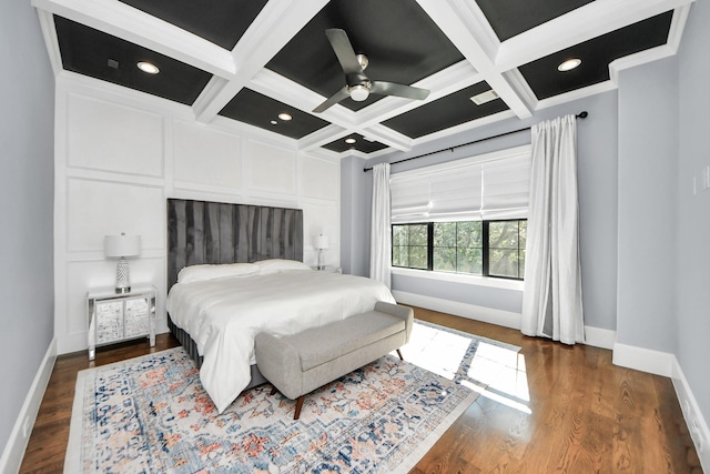 bedroom featuring dark wood-style floors, coffered ceiling, and baseboards