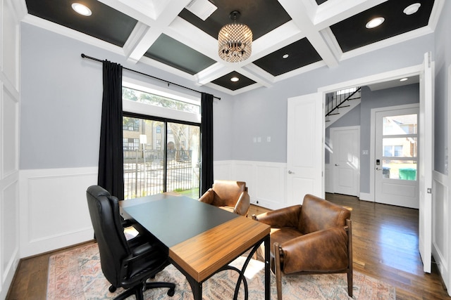 home office with a healthy amount of sunlight, dark wood-type flooring, and beamed ceiling