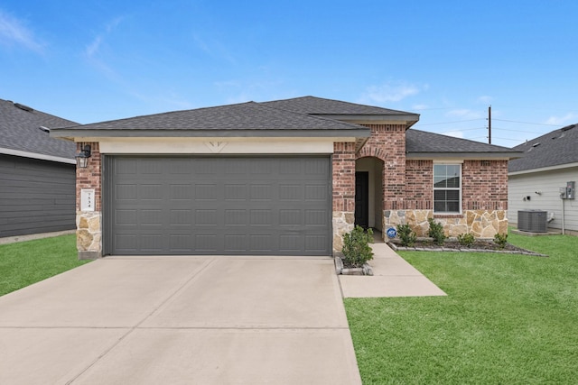 single story home featuring stone siding, brick siding, an attached garage, and roof with shingles